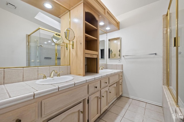 bathroom with tile patterned flooring and vanity