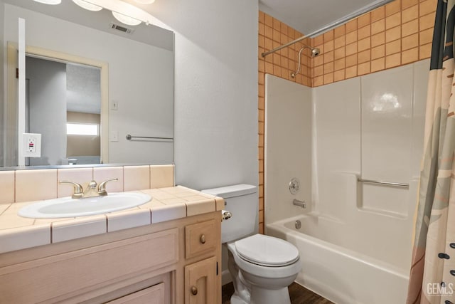 full bathroom featuring vanity, toilet, and shower / bath combo