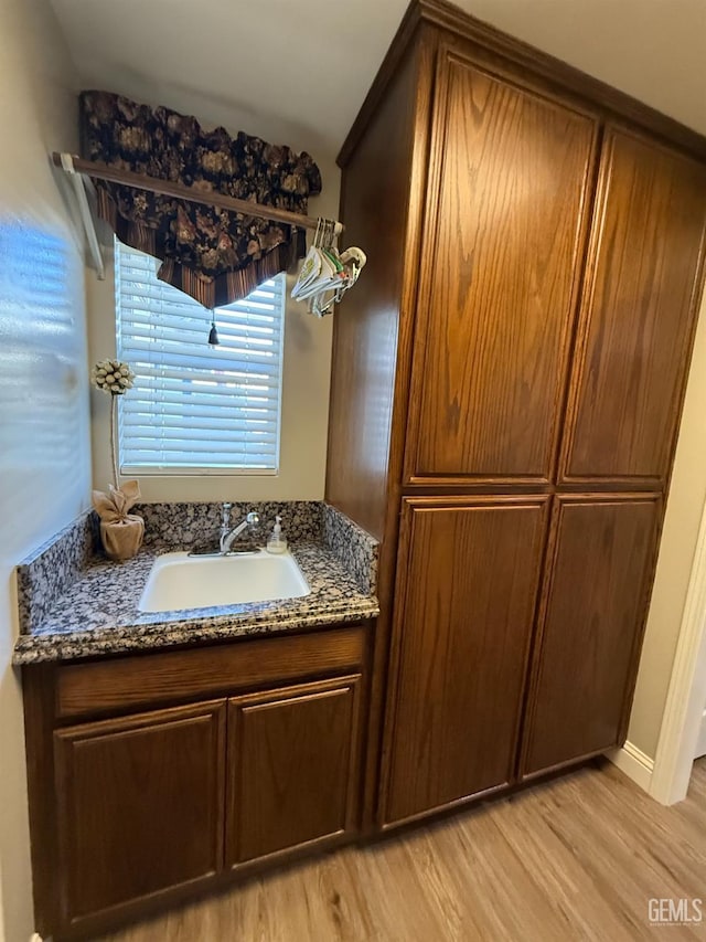 15725 Marty Ave, Bakersfield, CA 93314 - bathroom with a sink and wood finished floors