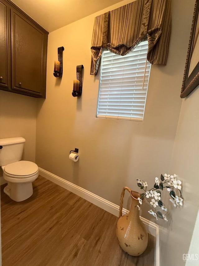 15725 Marty Ave, Bakersfield, CA 93314 - bathroom featuring toilet and wood finished floors