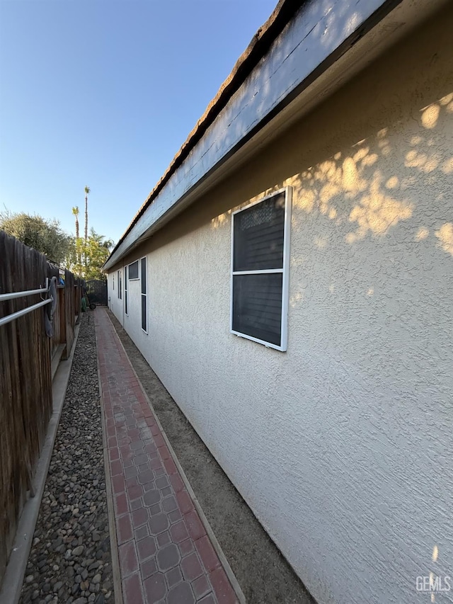 15725 Marty Ave, Bakersfield, CA 93314 - view of home's exterior with stucco siding and a fenced backyard
