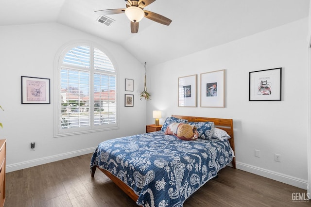 bedroom featuring ceiling fan, vaulted ceiling, and dark wood-type flooring