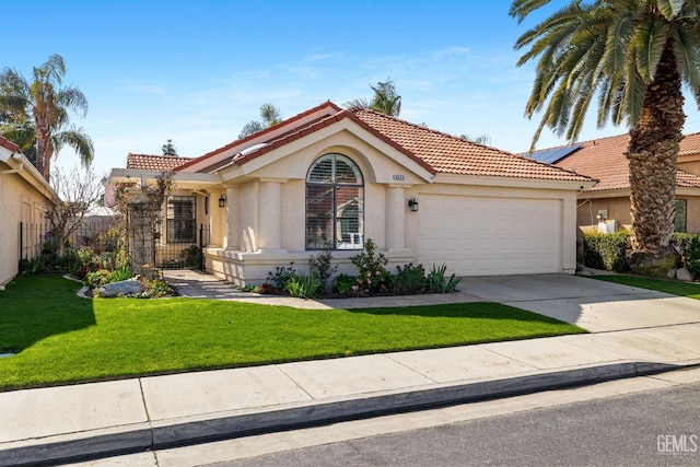 view of front facade with a front yard and a garage