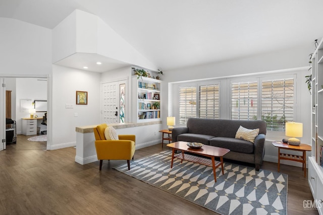 living room with high vaulted ceiling and dark hardwood / wood-style flooring