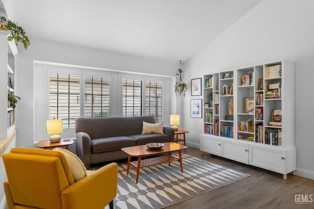 living room featuring dark hardwood / wood-style floors and lofted ceiling