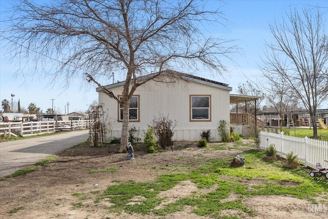 view of property exterior featuring fence