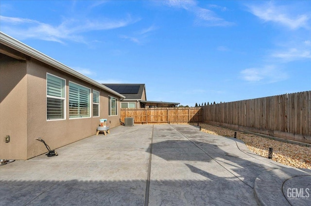 view of patio featuring central AC and a fenced backyard