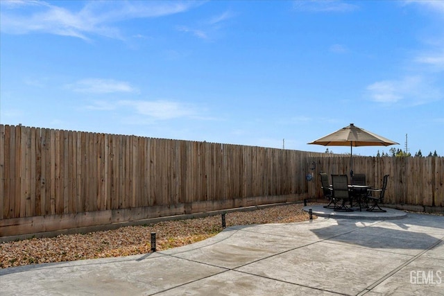 view of patio / terrace featuring a fenced backyard and outdoor dining space