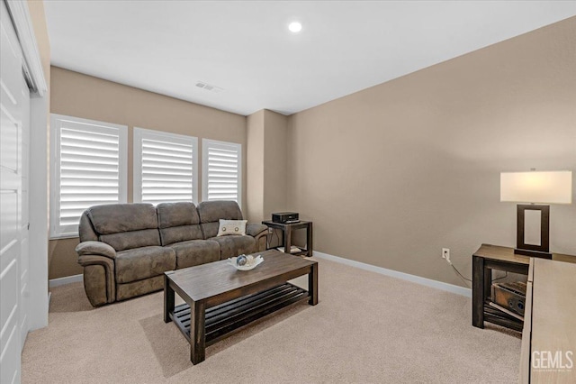 carpeted living room featuring recessed lighting, visible vents, and baseboards