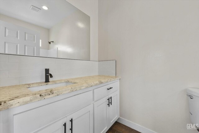 3409 Lotus Ln, Bakersfield, CA 93307 - bathroom with tasteful backsplash and vanity