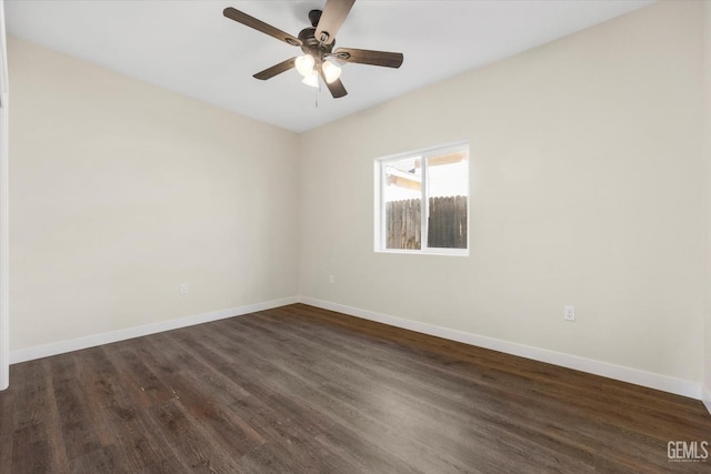 3409 Lotus Ln, Bakersfield, CA 93307 - empty room with dark wood finished floors and a ceiling fan