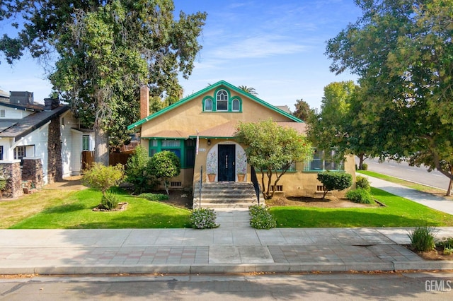 view of front of home with a front yard