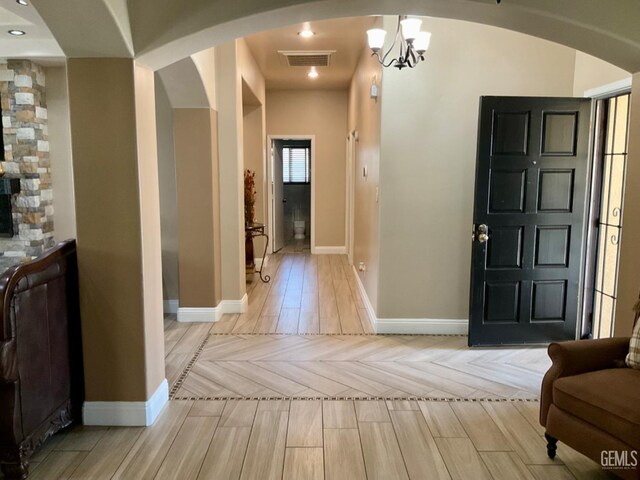 1904 Raymond A Spruance Ct, Bakersfield, CA 93304 - foyer with arched walkways, parquet flooring, and a chandelier