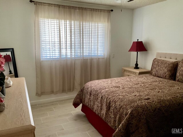 1904 Raymond A Spruance Ct, Bakersfield, CA 93304 - bedroom featuring light wood-type flooring and a textured ceiling