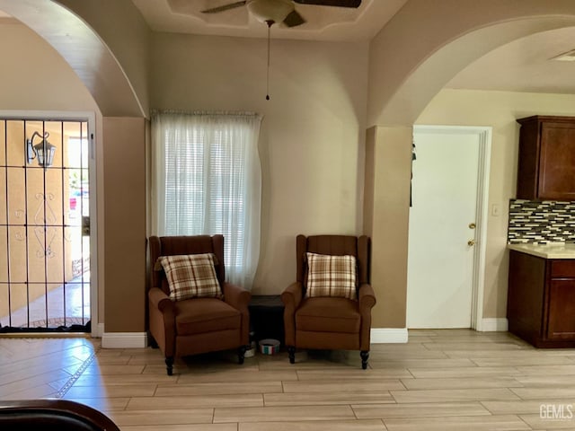 1904 Raymond A Spruance Ct, Bakersfield, CA 93304 - sitting room with arched walkways, light wood-type flooring, and a ceiling fan