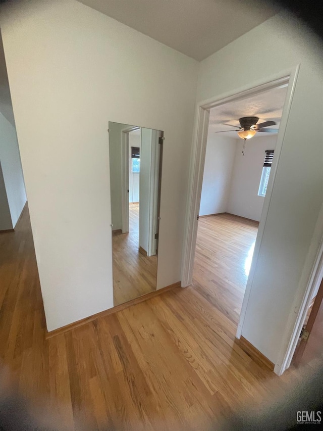 hall with light hardwood / wood-style flooring