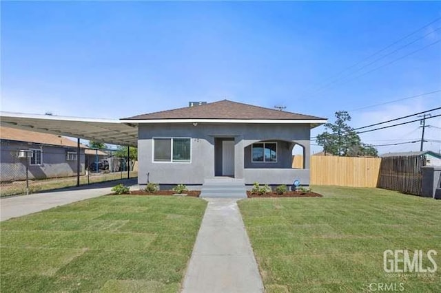 301 Kincaid St, Bakersfield, CA 93307 - view of front of house featuring a carport, driveway, and stucco siding