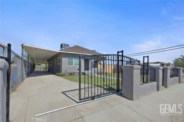 301 Kincaid St, Bakersfield, CA 93307 - view of front of home featuring concrete driveway and a carport