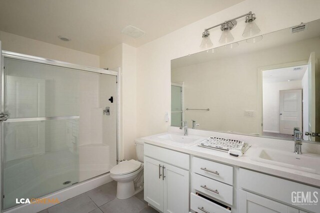 full bathroom featuring a shower stall, tile patterned flooring, and a sink