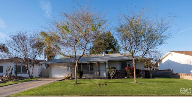 ranch-style house with a porch, fence, driveway, stucco siding, and a front lawn