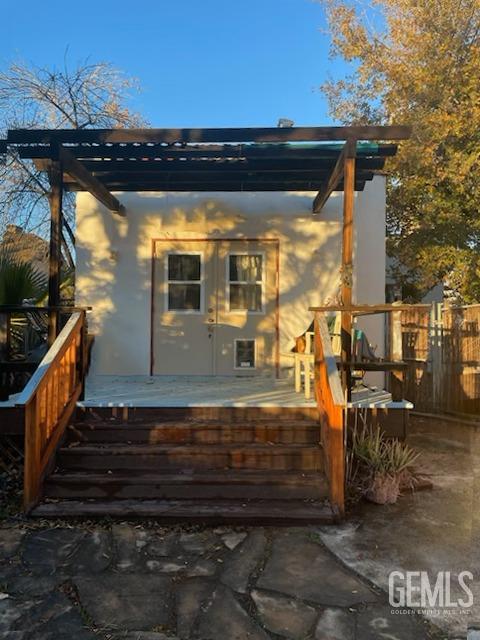 325 Flower St, Bakersfield, CA 93305 - exterior space featuring a deck and stucco siding