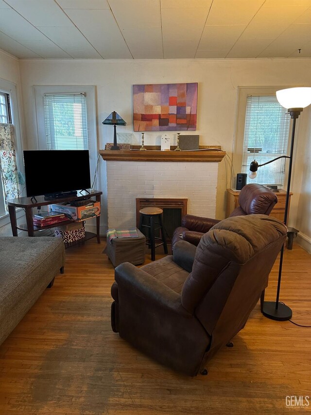 325 Flower St, Bakersfield, CA 93305 - living area with a brick fireplace and wood finished floors
