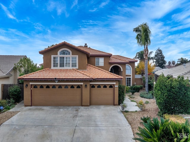 mediterranean / spanish-style house featuring a garage