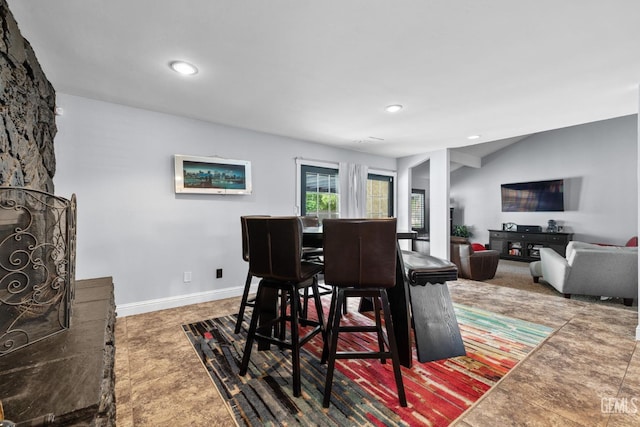 dining room featuring baseboards and recessed lighting