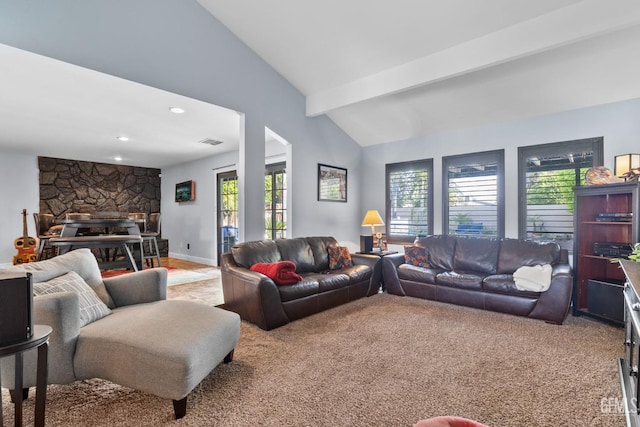carpeted living area featuring recessed lighting, lofted ceiling with beams, visible vents, and a fireplace