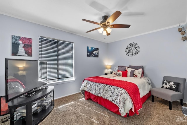 carpeted bedroom featuring baseboards, a ceiling fan, and ornamental molding