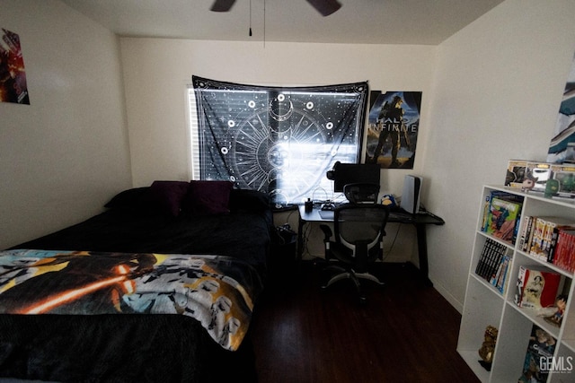 bedroom with a ceiling fan and wood finished floors