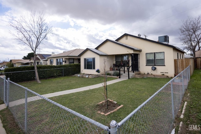 bungalow with a fenced front yard, a front yard, and stucco siding