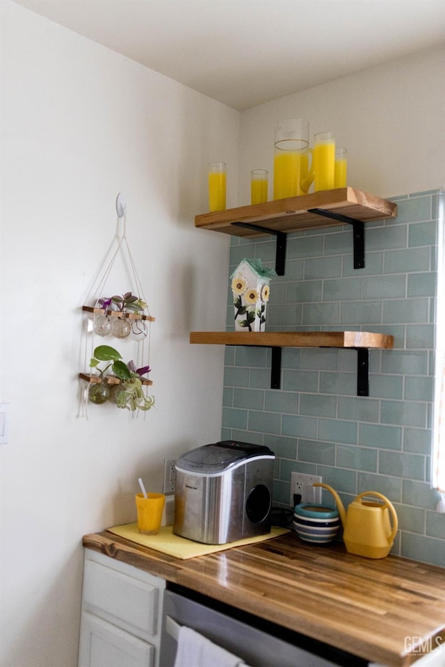 interior space with open shelves, white cabinetry, wooden counters, and decorative backsplash