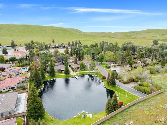 drone / aerial view with a rural view and a water view