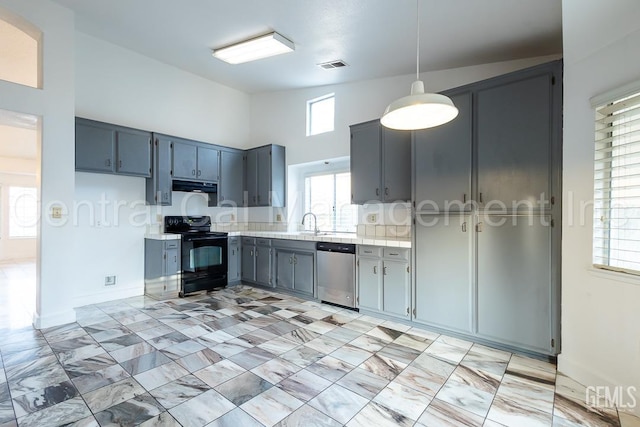 kitchen featuring sink, black electric range, stainless steel dishwasher, gray cabinets, and decorative light fixtures