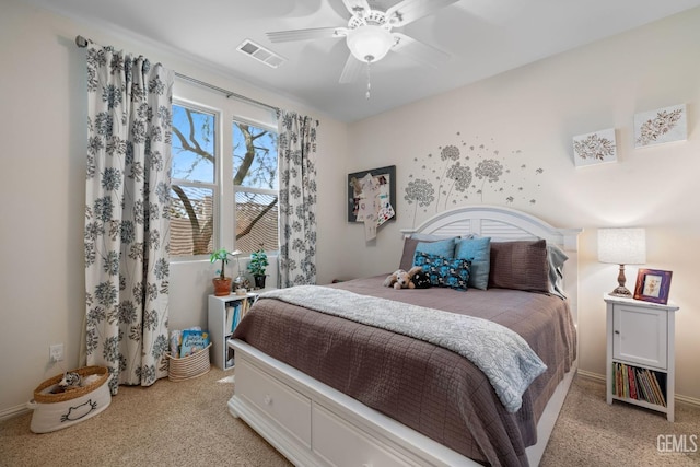 bedroom with ceiling fan and light colored carpet