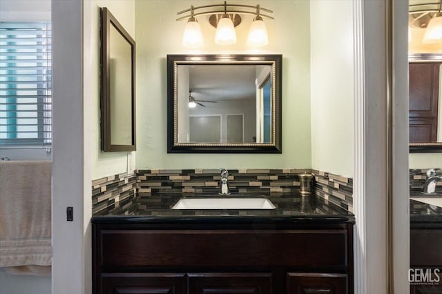 bathroom with decorative backsplash, a ceiling fan, and vanity