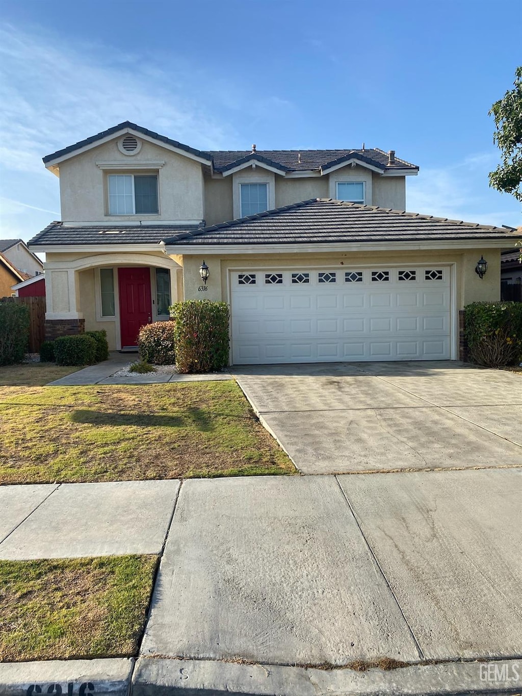 view of property featuring a front lawn