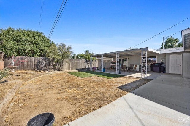 4418 Kevin Dr, Bakersfield, CA 93308 - fenced backyard with a patio area