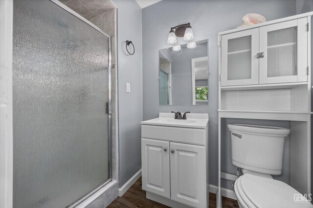 4418 Kevin Dr, Bakersfield, CA 93308 - bathroom featuring a shower stall, vanity, and wood finished floors