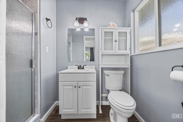 4418 Kevin Dr, Bakersfield, CA 93308 - bathroom featuring a shower stall, wood finished floors, and vanity