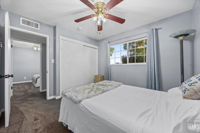4418 Kevin Dr, Bakersfield, CA 93308 - bedroom featuring dark carpet, a closet, and a ceiling fan