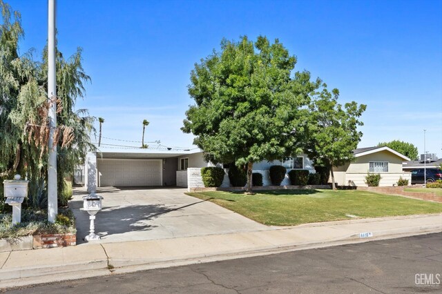 4418 Kevin Dr, Bakersfield, CA 93308 - view of front of property with concrete driveway, a garage, a front lawn, and stucco siding