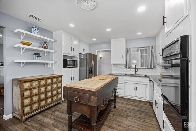 4418 Kevin Dr, Bakersfield, CA 93308 - kitchen featuring stainless steel appliances, open shelves, dark wood-type flooring, white cabinetry, and recessed lighting