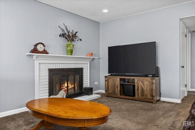 4418 Kevin Dr, Bakersfield, CA 93308 - living area with carpet, a textured ceiling, and a fireplace