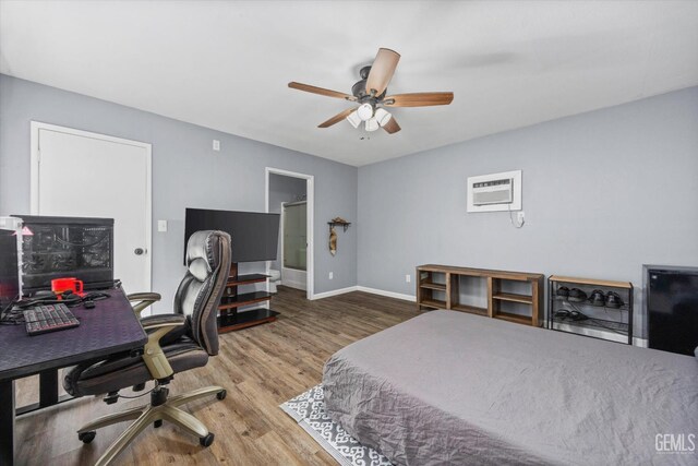 4418 Kevin Dr, Bakersfield, CA 93308 - bedroom with a wall mounted air conditioner, a desk, wood finished floors, and ceiling fan