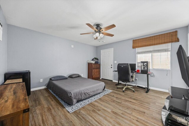 4418 Kevin Dr, Bakersfield, CA 93308 - bedroom featuring wood finished floors, an office area, and a ceiling fan