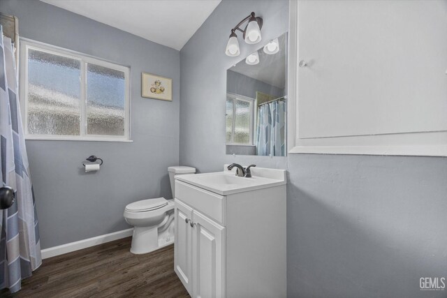 4418 Kevin Dr, Bakersfield, CA 93308 - full bathroom featuring vanity, wood finished floors, and curtained shower
