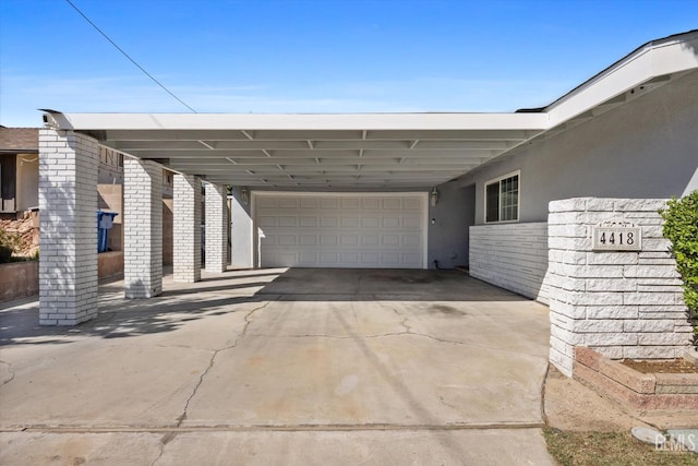 4418 Kevin Dr, Bakersfield, CA 93308 - view of vehicle parking with a garage, concrete driveway, and a carport