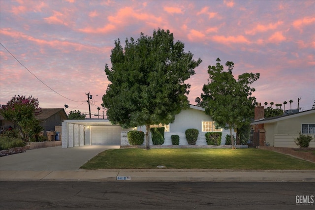 4418 Kevin Dr, Bakersfield, CA 93308 - view of front of house with driveway, a yard, and a carport